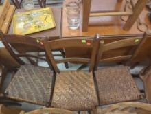 Lot of 4 Wooden Chairs with 2 Step Ladder Backs and Woven Seats Damage to Some Seats (Pictures