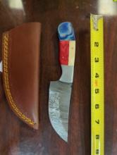 HANDMADE DAMASCUS STEEL STRAIGHT BACK KNIFE WITH RED, WHITE AND BLUE HANDLE. BLADE MEASURES 4.25".