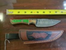HANDMADE DAMASCUS DROP POINT KNIFE WITH MULTI COLORED HANDLE. BLADE MEASURES 4". COMES WITH LEATHER