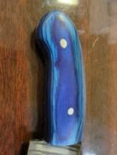 HANDMADE DAMASCUS DROP POINT KNIFE WITH BLUE WOODEN HANDLE. BLADE MEASURES 3". COMES WITH LEATHER
