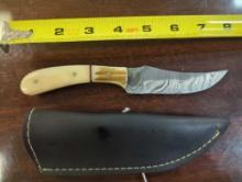HANDMADE DAMASCUS PERSIAN BLADE KNIFE WITH CREAM COLORED HANDLE. BLADE MEASURES 3.75". COMES WITH