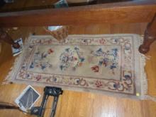 (BR2) SMALL ASIAN INSPIRED MACHINE MADE RUG. MEASURES APPROX 4' x 2'.
