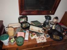 (BR3) CONTENTS ON TOP OF DRESSER. INCLUDES:KNOBLER MUG WITH SPENT AMMO, DECOR BRADED NECKLACE,