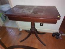 (BR3) ANTIQUE MAHOGANY GAME TABLE WITH DUNCAN PHYFE STYLE LEGS AND BRASS CAPPED FEET. APPEARS TO BE