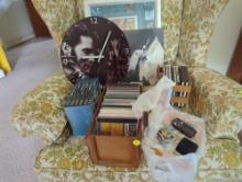 (LR) LARGE LOT OF ASSORTED ELVIS MEMORABILIA TO INCLUDE: CDS, DVDS, A WALL CLOCK, A PRINT, MUGS,