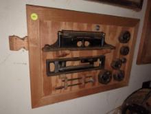 (SHED 2) STEM PUNK VINTAGE TOOL WALL ART. PIECES DISPLAYED ON A WOODEN BOARD. BOLTED TO THE WALL,