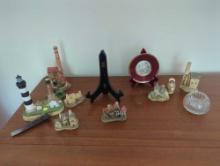 (LR) LOT OF ASSORTED ITEMS ON TABLE TO INCLUDE: RAILROAD SPIKE, BODIE ISLAND LIGHTHOUSE DECORATION