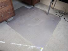 (OFC1) HARD PLASTIC OFFICE CHAIR FLOOR MAT. DOES DISPLAY SOME CRACKING. IT MEASURES APPROX. 47" X