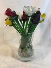 Glass blown roses and flowers in large clear glass vase. Vase is approx....10"