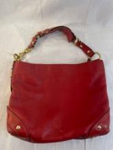 Coach red leather purse with gold colored accents