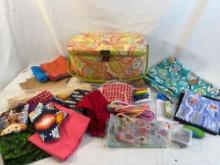 Padded sewing box with assorted fabrics and craft supplies