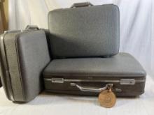 Set of three vintage, American Tourister suitcases. All three suitcases open and close and all