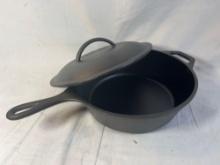 Lodge 10 inch cast iron skillet with lid.