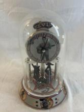 Vintage Elvis Presley anniversary clock with glass dome. Measures approx. 9".
