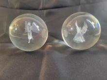 Set of two glass orbs with angel image inside