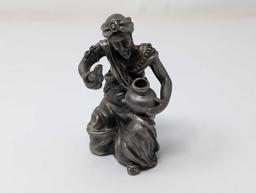 (FOYER) LENOX KIRK STIEFF PEWTER FIGURINE OF A MAN REMOVING A LID OFF OF A POT. MARKED ON THE