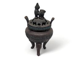 (FOYER) ANTIQUE TIBETAN BRONZE TONED INCENSE BURNER FEATURING A FOO DOG DETAILED LID, GREEK KEY