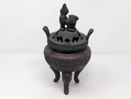 (FOYER) ANTIQUE TIBETAN BRONZE TONED INCENSE BURNER FEATURING A FOO DOG DETAILED LID, GREEK KEY