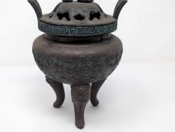 (FOYER) ANTIQUE TIBETAN BRONZE TONED INCENSE BURNER FEATURING A FOO DOG DETAILED LID, GREEK KEY