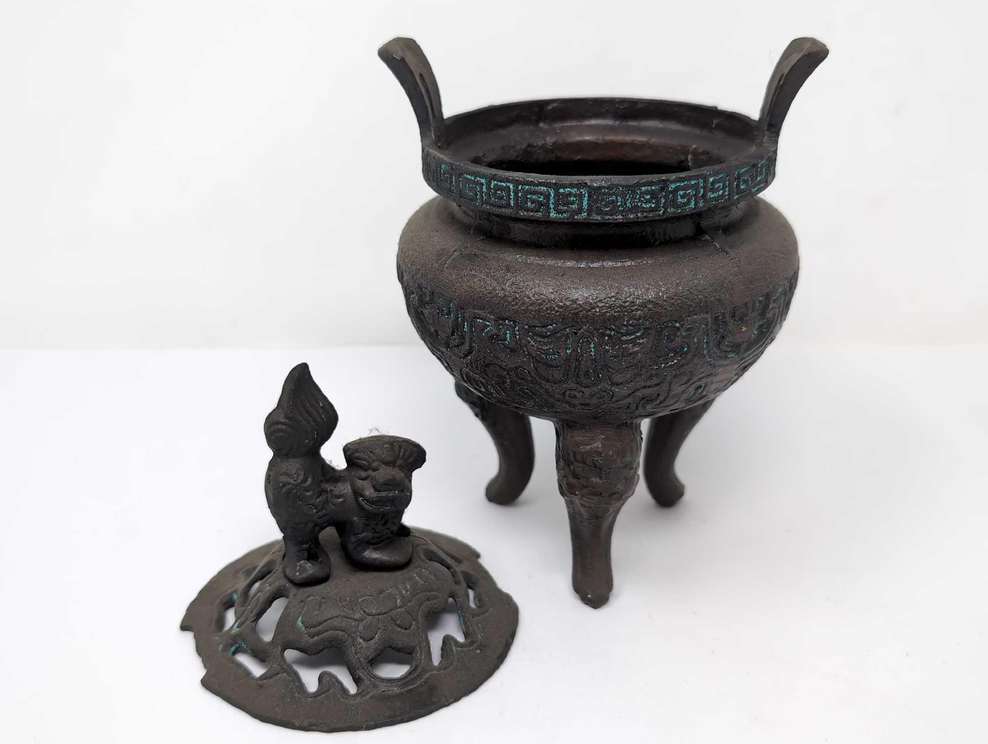 (FOYER) ANTIQUE TIBETAN BRONZE TONED INCENSE BURNER FEATURING A FOO DOG DETAILED LID, GREEK KEY