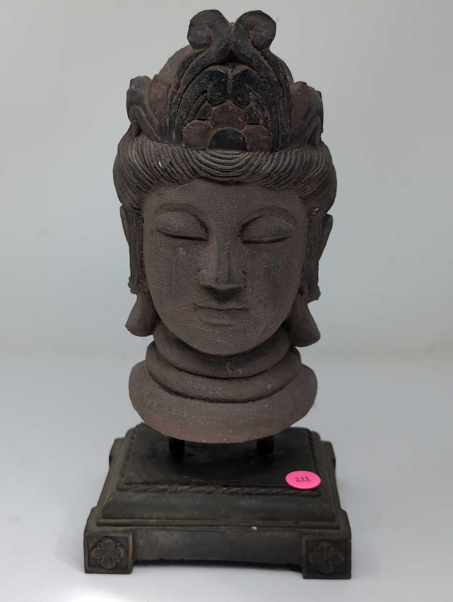 (LR) VINTAGE COMPOSITION BUDDHA HEAD DISPLAYED ON A SQUARE DETAILED BASE. IT MEASURES APPROX.