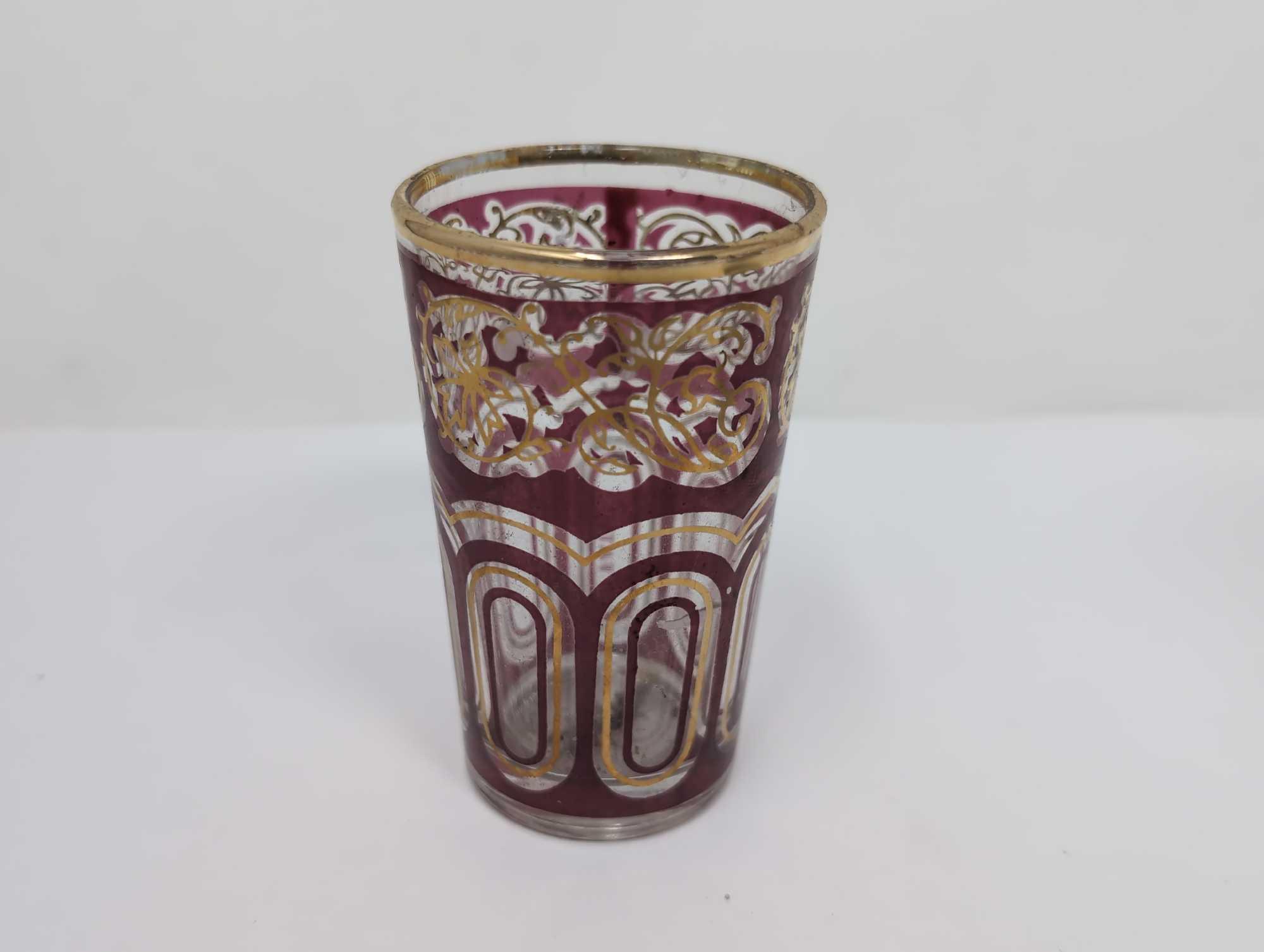 (FOYER) 4 PC. LOT TO INCLUDE A RUBY RED & GOLD CUT TO CLEAR SHOT GLASS MARKED FATH 3-1/2"T, A NAPCO