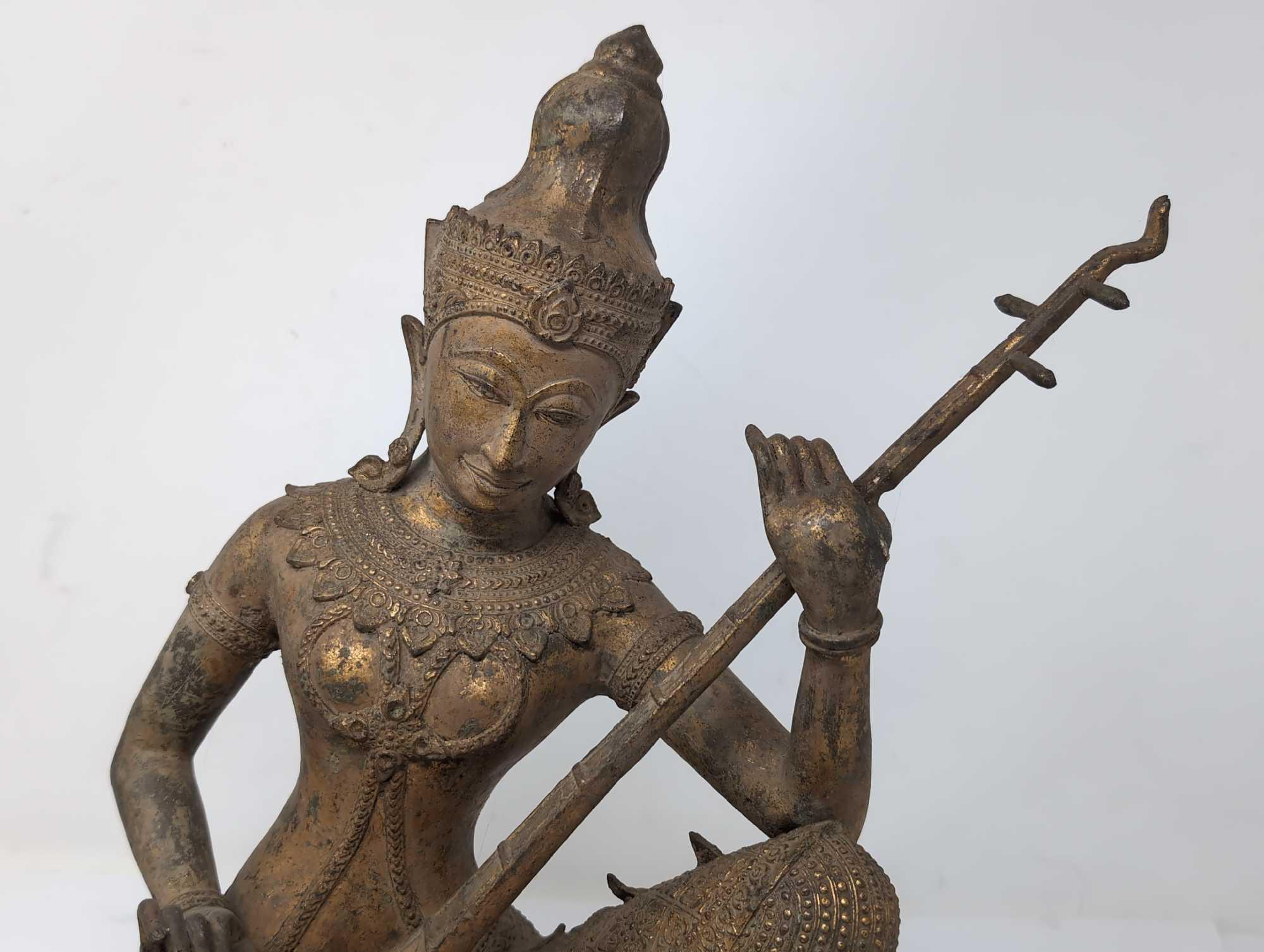 (LR) OUTSTANDING THAILAND GILDED BRONZE STATUE OF SARASWATI PLAYING A VINA. VERY DETAILED. IT