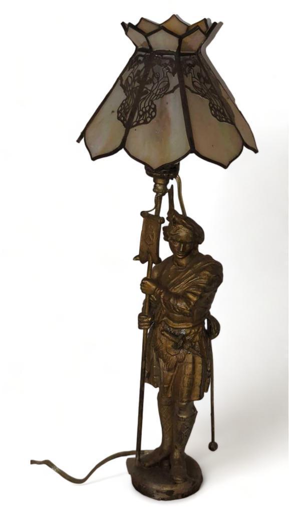 (FOY) ANTIQUE METAL ON WHITE STONE TABLE LAMP, FIGURINE OF A SPELTER SOLDIER HOLDING A BANNER, HAS A