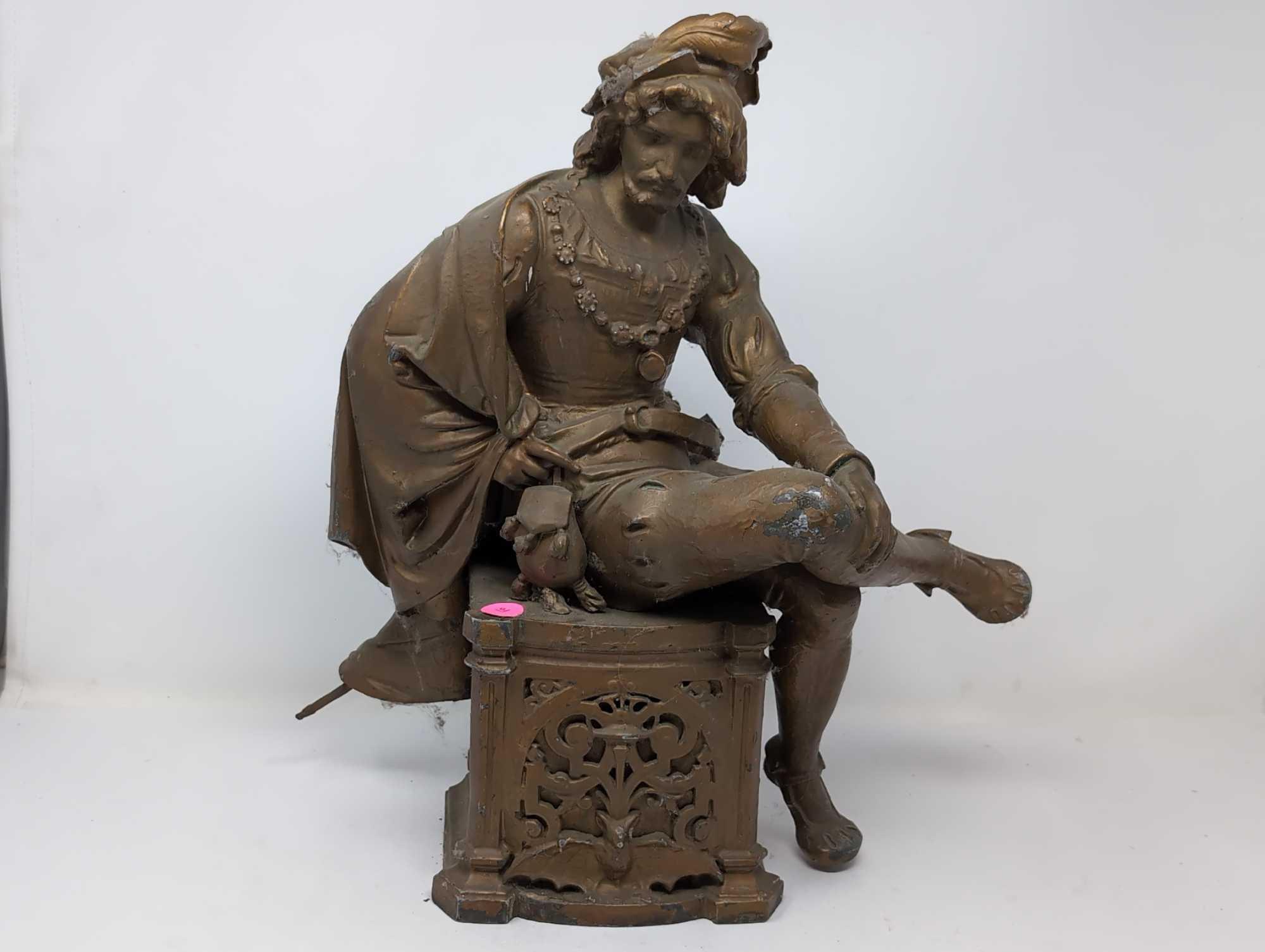 (FOYER) ANTIQUE VICTORIAN SPELTER STATUE DEPICTING AN ENGLISHMAN SITTING ON AN ORNATE BAT DETAILED