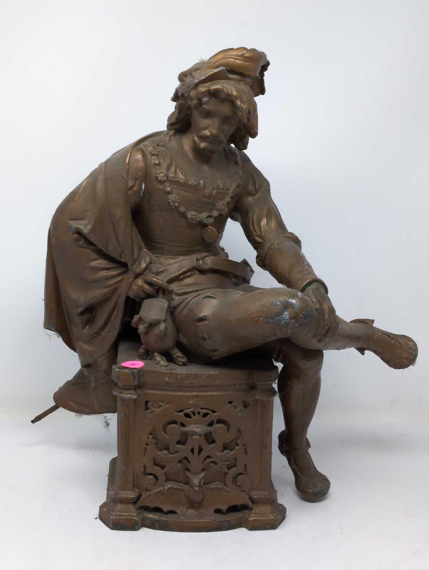 (FOYER) ANTIQUE VICTORIAN SPELTER STATUE DEPICTING AN ENGLISHMAN SITTING ON AN ORNATE BAT DETAILED