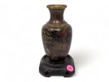 (FOYER) VINTAGE BROWN FLORAL CHINESE CLOISONNE SMALL VASE WITH CARVED WOODEN DISPLAY STAND. THE VASE