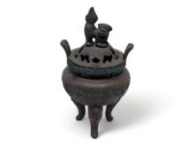 (FOYER) ANTIQUE TIBETAN BRONZE TONED INCENSE BURNER FEATURING A FOO DOG DETAILED LID, GREEK KEY