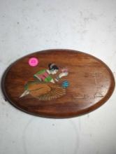 (LR) WOOD OVAL WALL PLAQUE DECORATION, INLAYED COLORED STONE, DEPICTS A WOMAN OFFERING TO THEIR GOD,