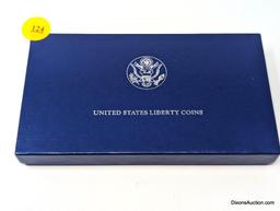 1986 Liberty Coins - Silver Dollar and Clad Half Dollar