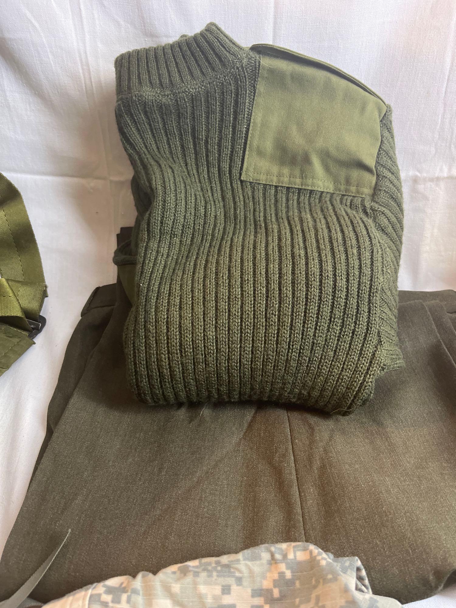 Lot of military surplus, clothes, boots, bag