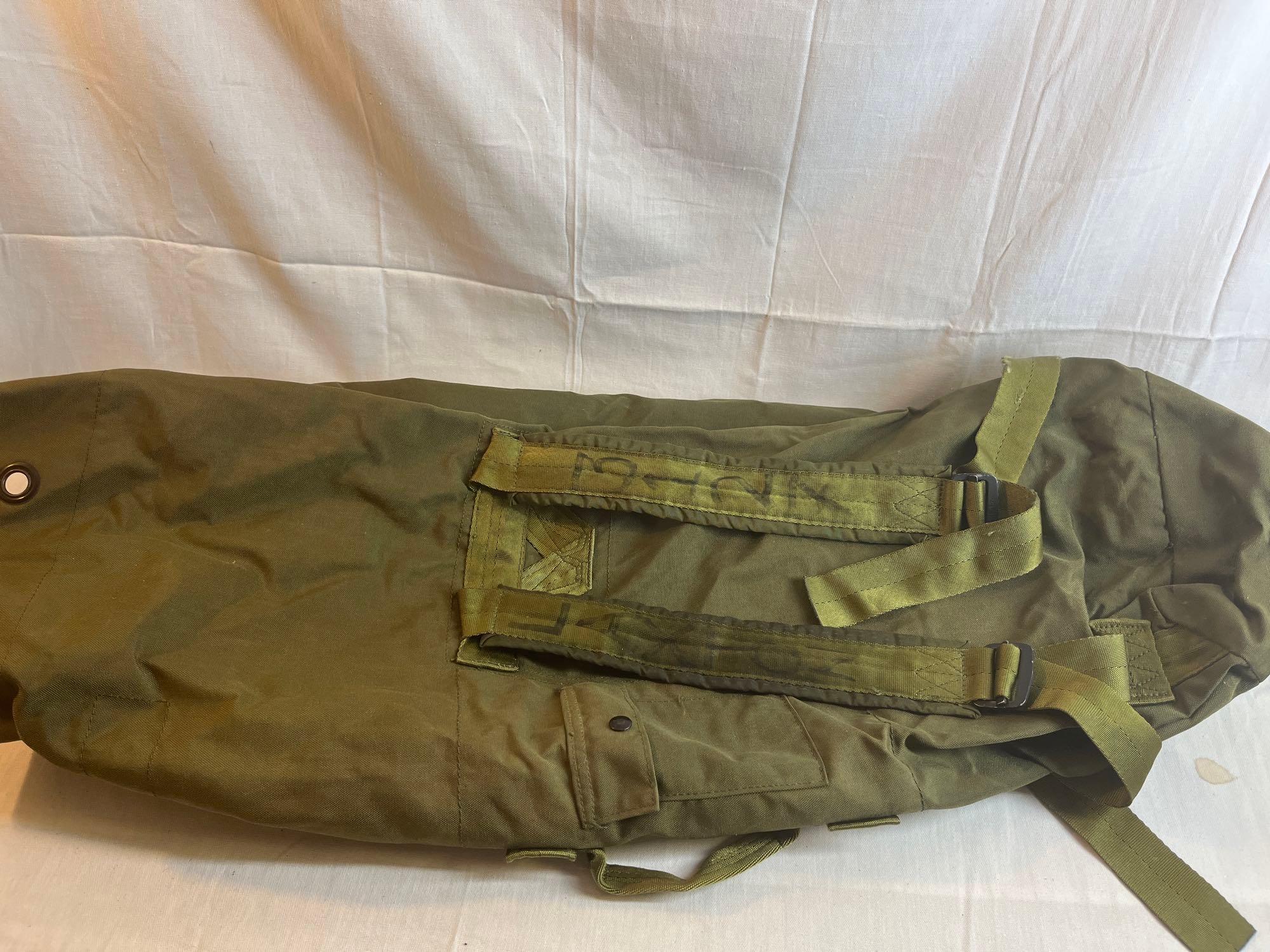 Lot of military surplus, clothes, boots, bag