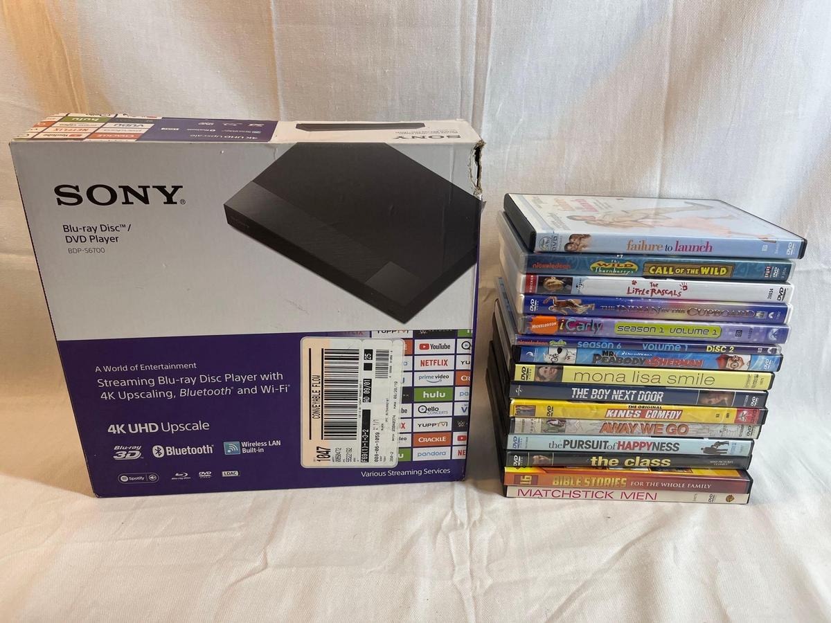 Brand new Sony Blu Ray DVD player in box. Lot of DVDs.