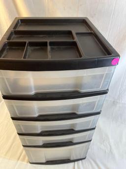 Black and clear plastic storage container with drawers. 25" tall.