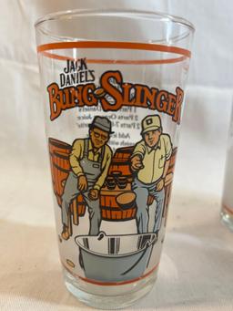 Drinking glass lot: three Jack Daniels Bung Slinger glasses, one Duff Simpsons glass