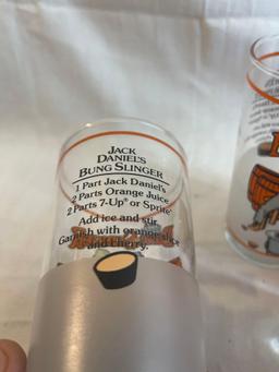 Drinking glass lot: three Jack Daniels Bung Slinger glasses, one Duff Simpsons glass