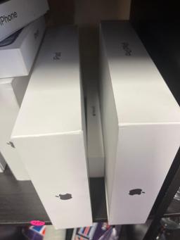 Lot of empty Apple product boxes.