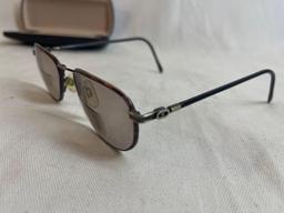 Wire framed bifocal glasses with case.