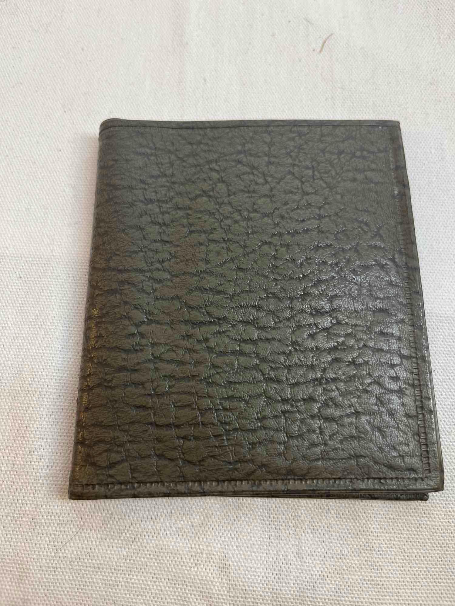 Palm pilot with wallet case, decorative...metal cigarette...case, leather wallet.