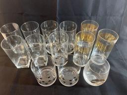 Set of glassware. Clear glass with gold accents.