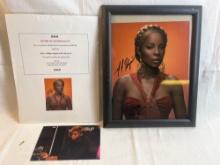 Autographed photo of Mary J. Blige with certificate of authenticity. 8x10.