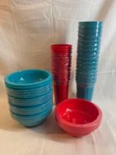 Lot of new plastic bowls and cups in red and turquoise.