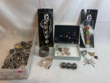 Costume jewelry lot: bracelets, brooches, button covers, necklaces, etc....