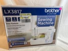 Like new in box Brother 17-stitch Sewing Machine LX3817 and sewing accessories.