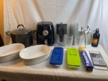 Kitchen lot: white baking dishes, large stock pot with lid, Bella air fryer, ice trays with lids,