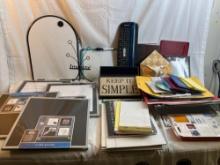 Large lot of office supplies including tote, notepads, several new whiteboards, calculators,